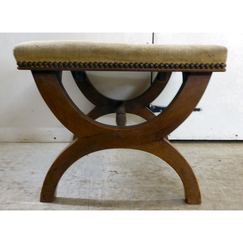 282 - A late Victorian mahogany framed stool with a tapestry upholstered top, raised on arched legs