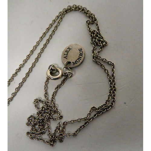 283 - An Alex Monroe silver pendant globe, on a fine neckchain and ring bolt clasp