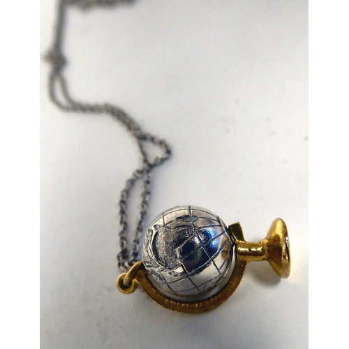 283 - An Alex Monroe silver pendant globe, on a fine neckchain and ring bolt clasp