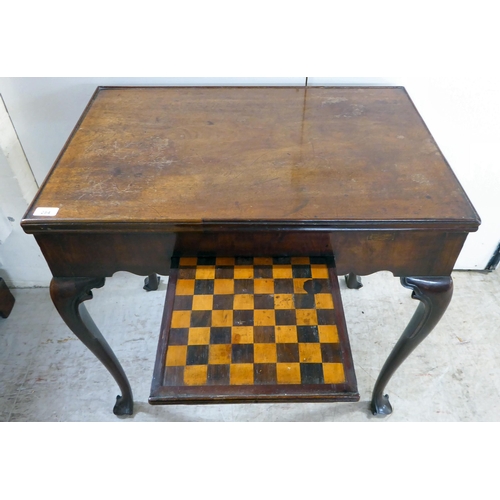 284 - A George III mahogany games table, the top revealing a baize lined card table, backgammon and a ches... 