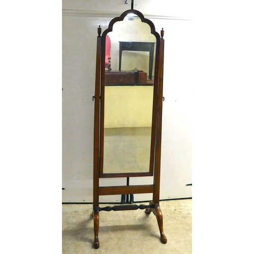 289 - A 1930s mahogany framed cheval mirror with a plain plate, raised on splayed legs with pad feet ... 