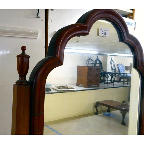 289 - A 1930s mahogany framed cheval mirror with a plain plate, raised on splayed legs with pad feet ... 