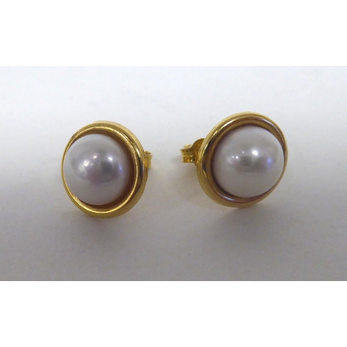 291 - A pair of 18ct gold, pearl set earrings