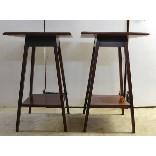 292 - A pair of Edwardian mahogany two-tier occasional/hall tables, raised on square legs  27