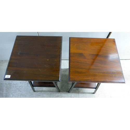 292 - A pair of Edwardian mahogany two-tier occasional/hall tables, raised on square legs  27