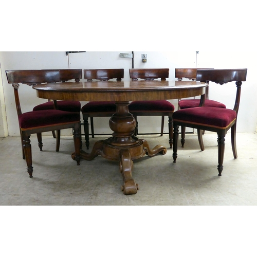 294 - An early Victorian mahogany breakfast table with a tip-top, over a turned column and splayed legs  2... 