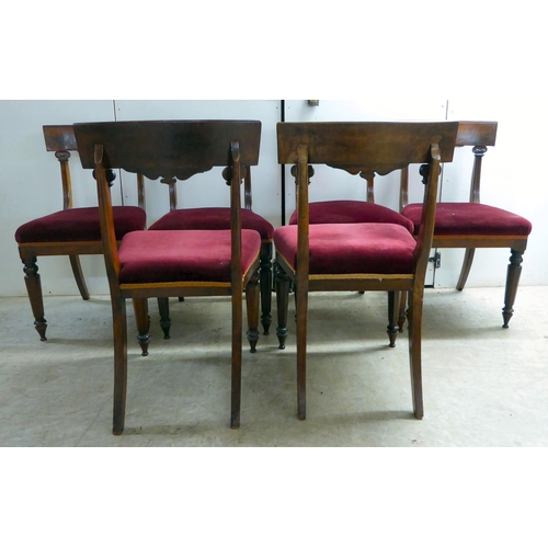 294 - An early Victorian mahogany breakfast table with a tip-top, over a turned column and splayed legs  2... 