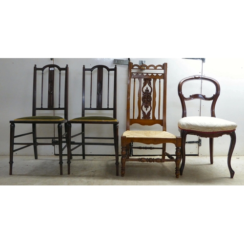 297 - Four dissimilar chairs: to include a pair of Edwardian mahogany framed, splat-back hall chairs, the ... 