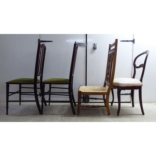 297 - Four dissimilar chairs: to include a pair of Edwardian mahogany framed, splat-back hall chairs, the ... 