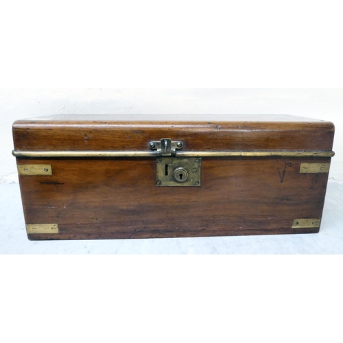 304 - A 19thC military/campaign style brass bound mahogany box with straight sides and a hinged lid, enclo... 