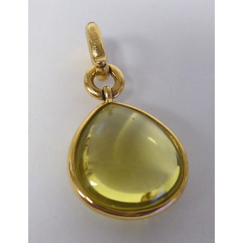 306 - An 18ct gold, lemon quartz set pendant, on a clip