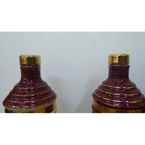 37 - Six various Bells Extra Special Old Scotch whisky  70cl in Wade china decanters  boxed