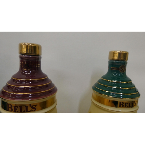 37 - Six various Bells Extra Special Old Scotch whisky  70cl in Wade china decanters  boxed