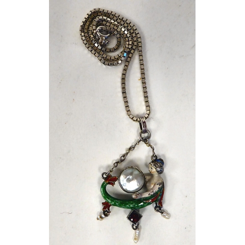 382 - An early 20thC probably white metal and coloured enamel novelty mermaid pendant with an unmatched bo... 