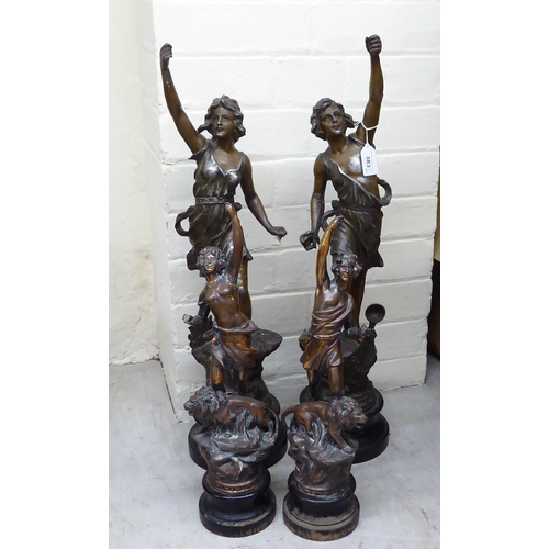 383 - Two pairs of spelter figure clock garnitures  14