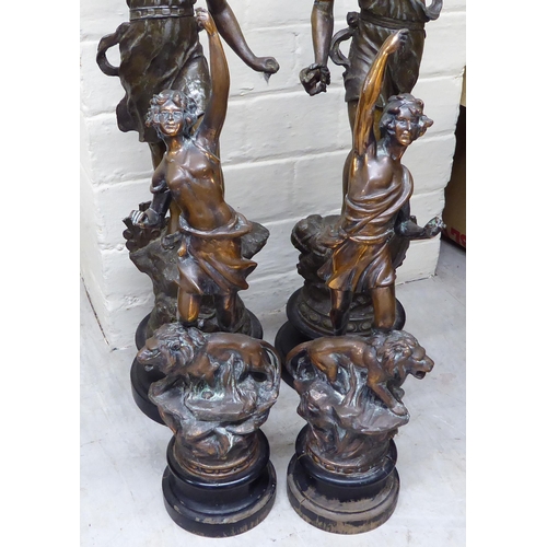 383 - Two pairs of spelter figure clock garnitures  14