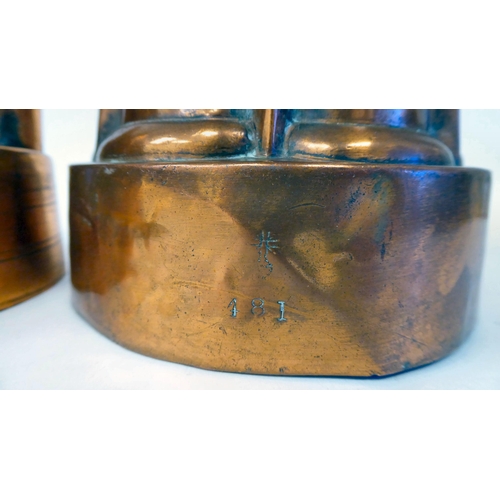 392 - A 19thC copper jelly mould of circular castellated design; and another similar of oval form