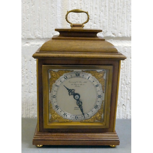 401 - An early 20thC brass and glazed mantel clock; the mercury weighted movement faced by an Arabic dial&... 