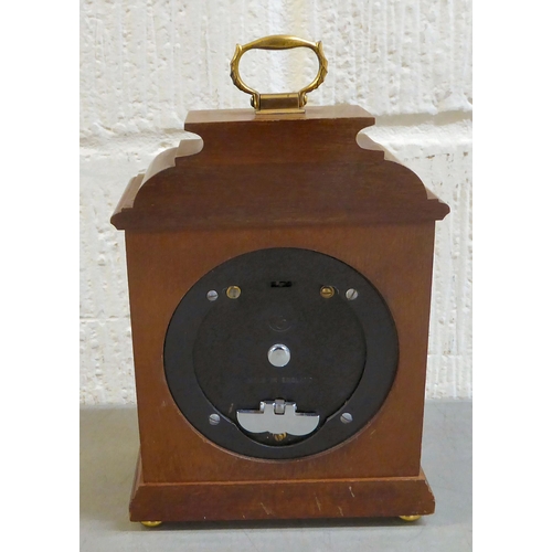 401 - An early 20thC brass and glazed mantel clock; the mercury weighted movement faced by an Arabic dial&... 