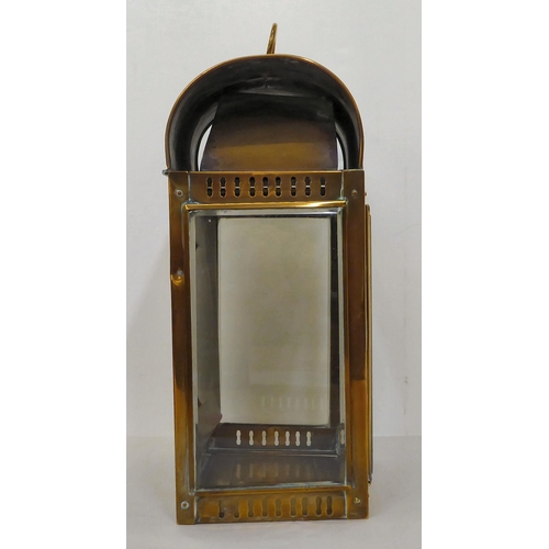 43 - A 19thC portable brass cased lantern with bevelled, clear glass panels, a folding top handle, bracke... 