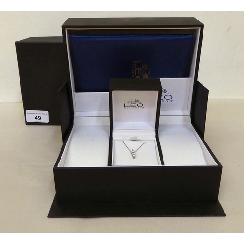 49 - The Leo Diamond 18ct white gold pendant, set with three diamonds, on a fine neckchain  boxed wi... 