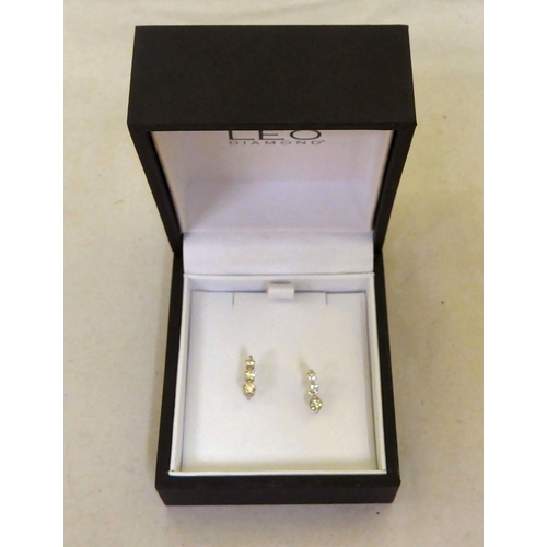 50 - The Leo Diamond pair of 18ct white gold earrings, set with 3 x 3 diamonds  boxed with certifica... 