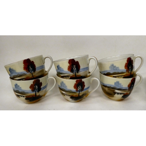 7 - A Japanese porcelain tea set, decorated with a landscape scene