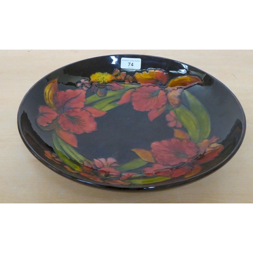 74 - A Moorcroft pottery Orchid pattern shallow bowl  12