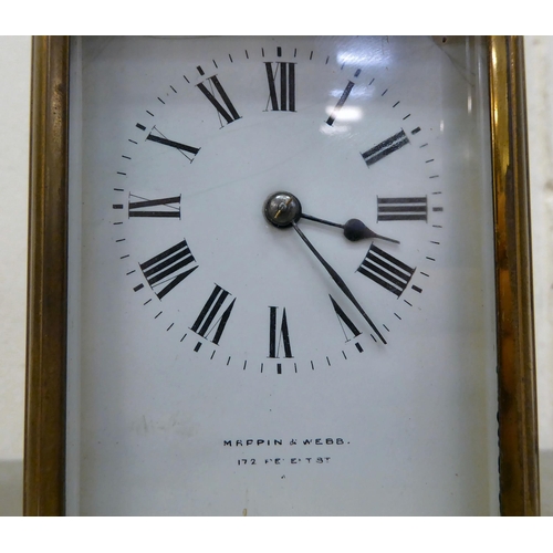 75 - A Mappin & Webb brass cased and glazed carriage clock; the movement faced by a Roman dial  7