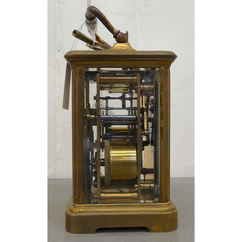 75 - A Mappin & Webb brass cased and glazed carriage clock; the movement faced by a Roman dial  7