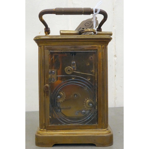 75 - A Mappin & Webb brass cased and glazed carriage clock; the movement faced by a Roman dial  7