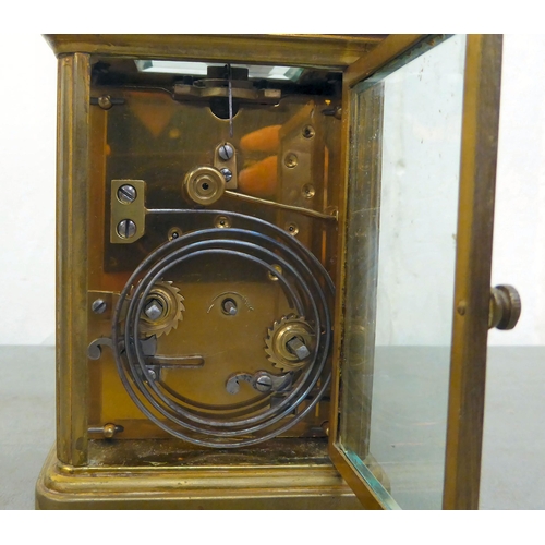 75 - A Mappin & Webb brass cased and glazed carriage clock; the movement faced by a Roman dial  7