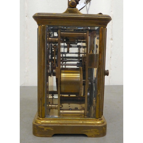 75 - A Mappin & Webb brass cased and glazed carriage clock; the movement faced by a Roman dial  7