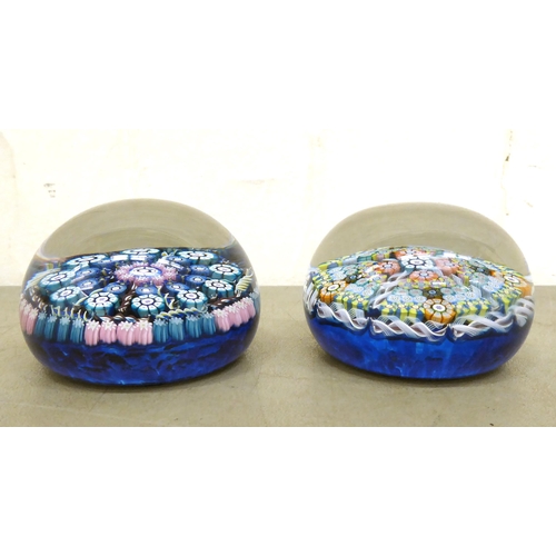 78 - Two millefiori glass paperweights, one bearing a label for Perthshire Paperweights, Crieff, Scotland... 