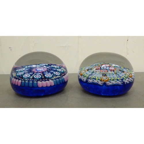 78 - Two millefiori glass paperweights, one bearing a label for Perthshire Paperweights, Crieff, Scotland... 