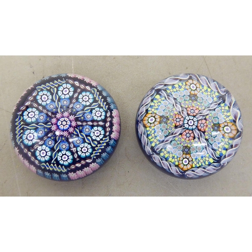 78 - Two millefiori glass paperweights, one bearing a label for Perthshire Paperweights, Crieff, Scotland... 