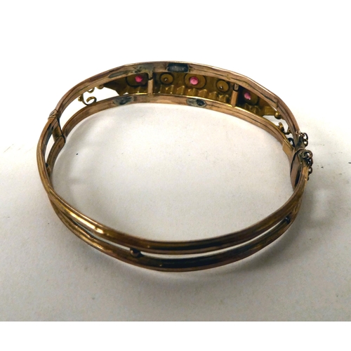 8 - A 9ct gold bangle, set with diamonds and rubies; and a yellow metal ring, set with a sapphire