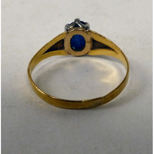 8 - A 9ct gold bangle, set with diamonds and rubies; and a yellow metal ring, set with a sapphire