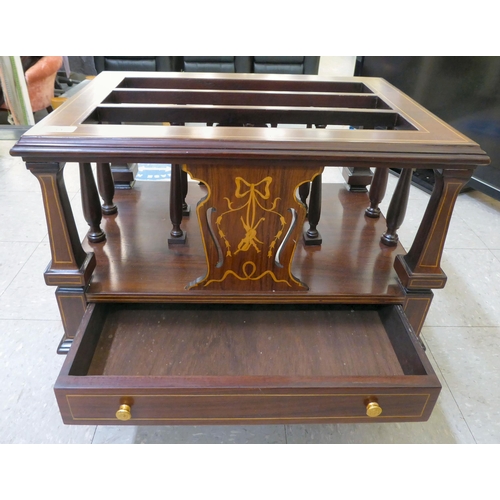 14 - An Edwardian style string inlaid, mahogany three division Canterbury, over a long drawer, raised on ... 