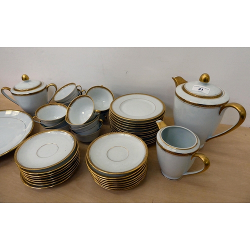 41 - Limoges porcelain tableware, decorated with patterned gilt banding