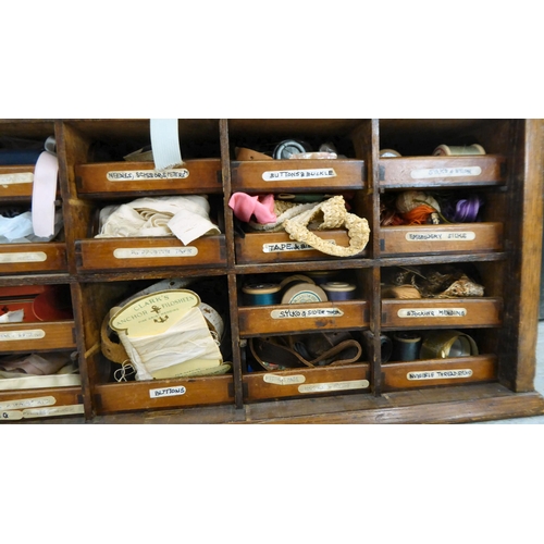 103 - An early 20thC oak chest with a rise-and-slide lockable front, enclosing a drawer interior  16