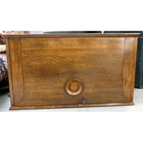 103 - An early 20thC oak chest with a rise-and-slide lockable front, enclosing a drawer interior  16