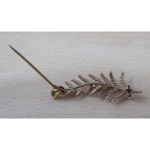 12 - A 9ct gold and pearl set, leaf design brooch