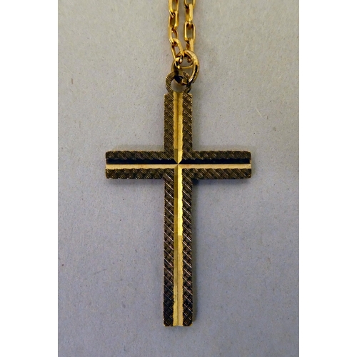 202 - A 9ct gold cross pendant, on a fine 9ct gold neckchain