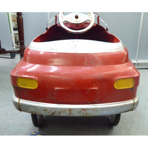 232 - A mid 20thC tinplate pedal car, in red livery, fashioned as a Fire Department Chief vehicle  36