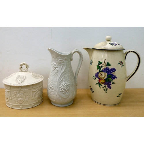 25 - Decorative ceramics: to include a late 18thC creamware lidded jug, decorated with flowers 