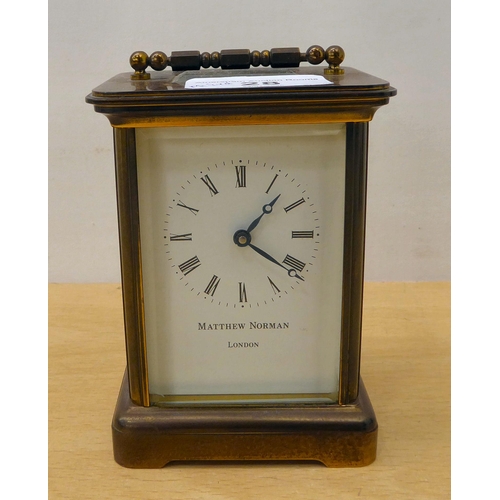 28 - A mixed lot: to include a Matthew Norman brass cased carriage clock, faced by a Roman dial  5