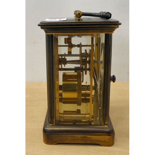 28 - A mixed lot: to include a Matthew Norman brass cased carriage clock, faced by a Roman dial  5