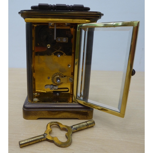 28 - A mixed lot: to include a Matthew Norman brass cased carriage clock, faced by a Roman dial  5