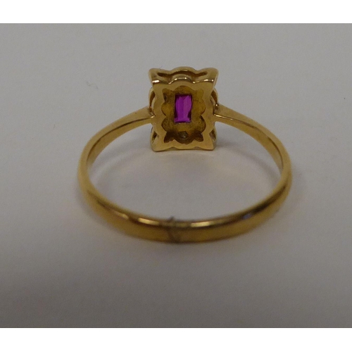 36 - An 18ct gold rectangular ruby and diamond set ring 